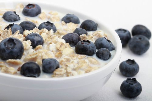 No added sugar muesli with semi-skimmed milk and blueberries