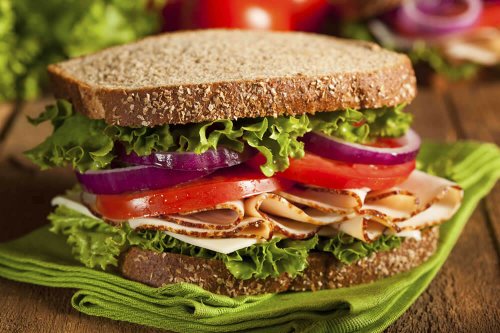 Turkey sandwich with lettuce, tomato and onion